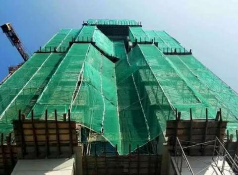 Interesting facts why under construction building is covered with green curtain 1